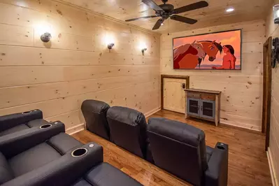 home theater in a pigeon forge cabin called smoky mountain retreat